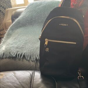 Tumi Black Nylon Sling Bag with Gold Zippers
